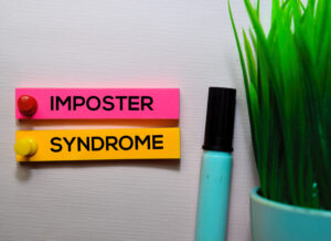 Read more about the article Can Impostor Syndrome Help You on Your Desk?